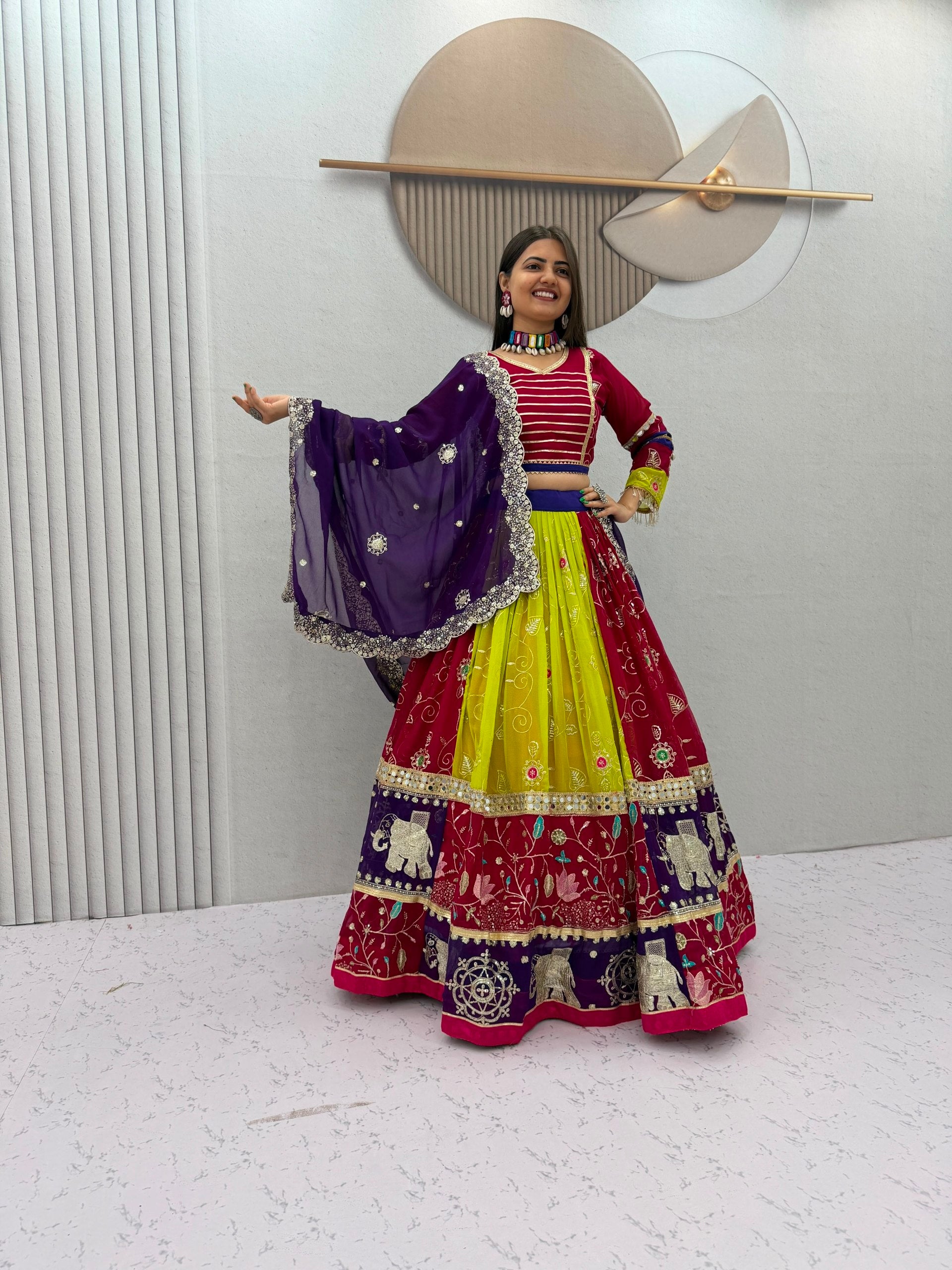 Model Posing Indoors Wearing Multicolor Fox Georgette Embroidery Thread & Sequence Work Navratri Lehenga Choli Set By The Beauty Queen