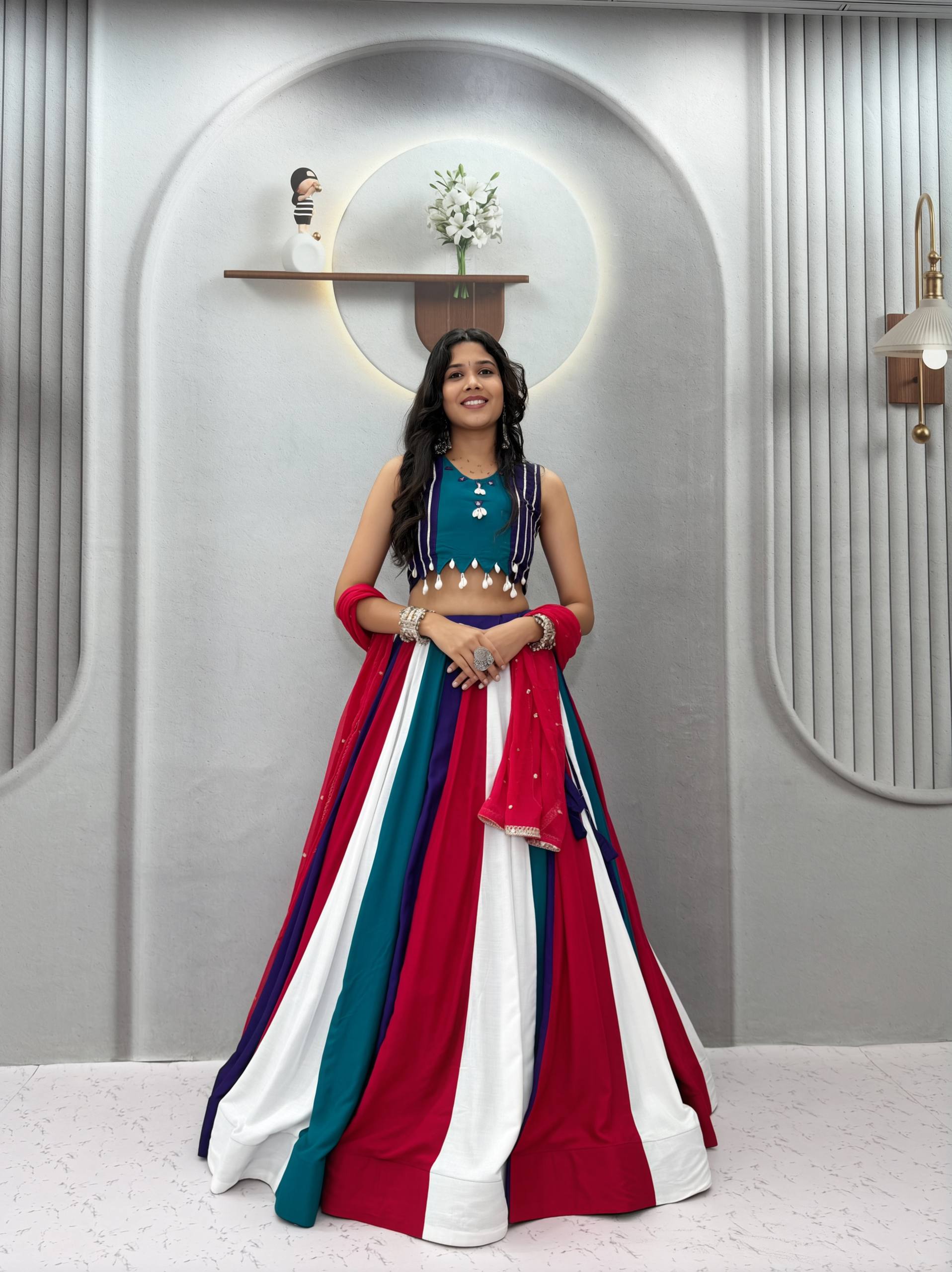Model Posing Indoors Wearing Multicolor Pure Cotton Hand Mirror Work & Thread Work Navratri Lehenga Choli Set By The Beauty Queen