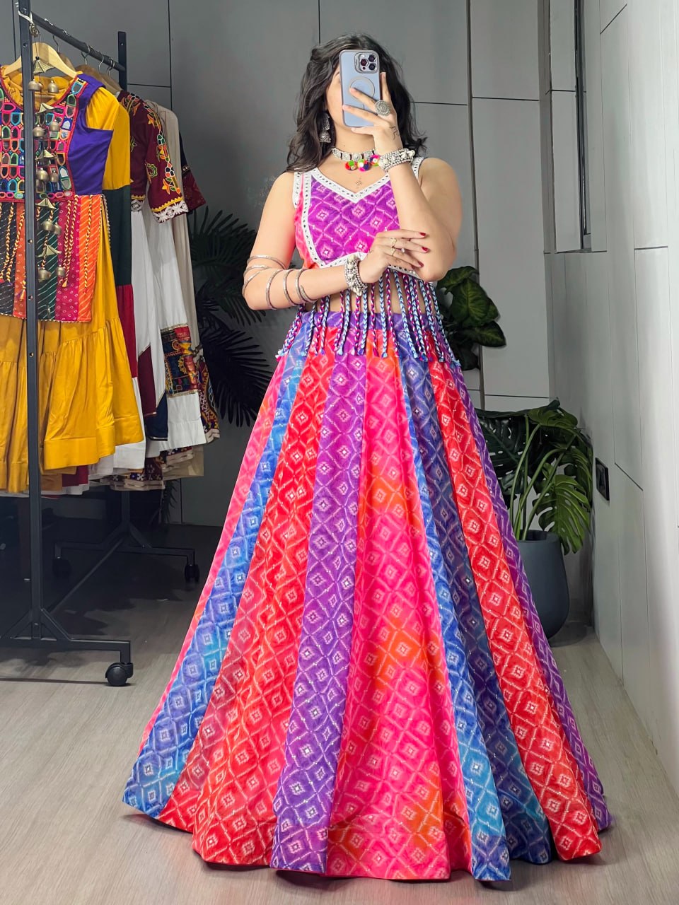 Model Wearing Multicolored Bandhani Faux Print And Foil Print Kali Work Navratri Lehenga Choli Set With Tassel Details By The Beauty Queen