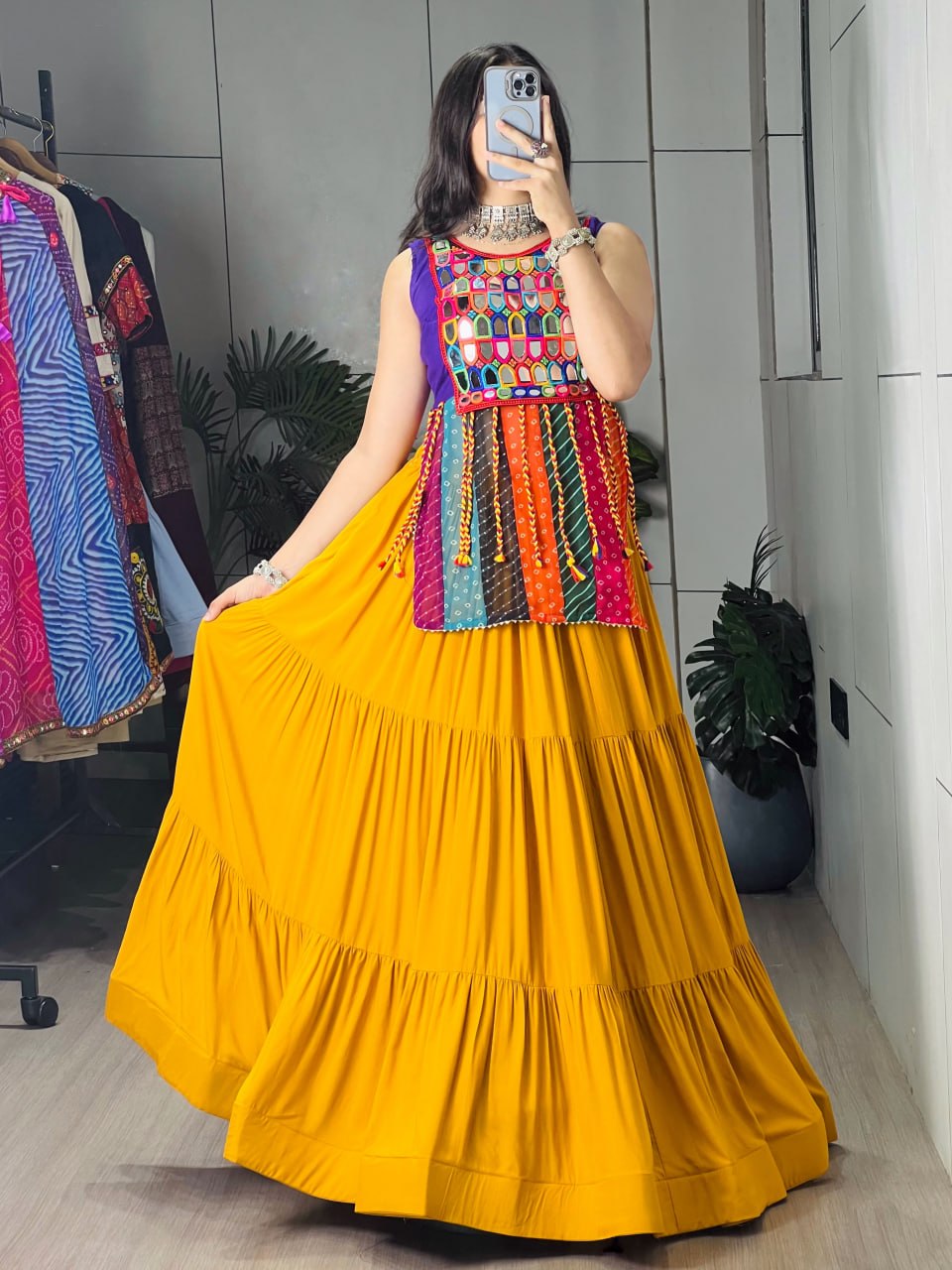 Model Wearing Mustard Yellow Pure Rayon Cotton Tiered Frilled Flairy Navratri Lehenga Choli Set With Mirror Work Top By The Beauty Queen