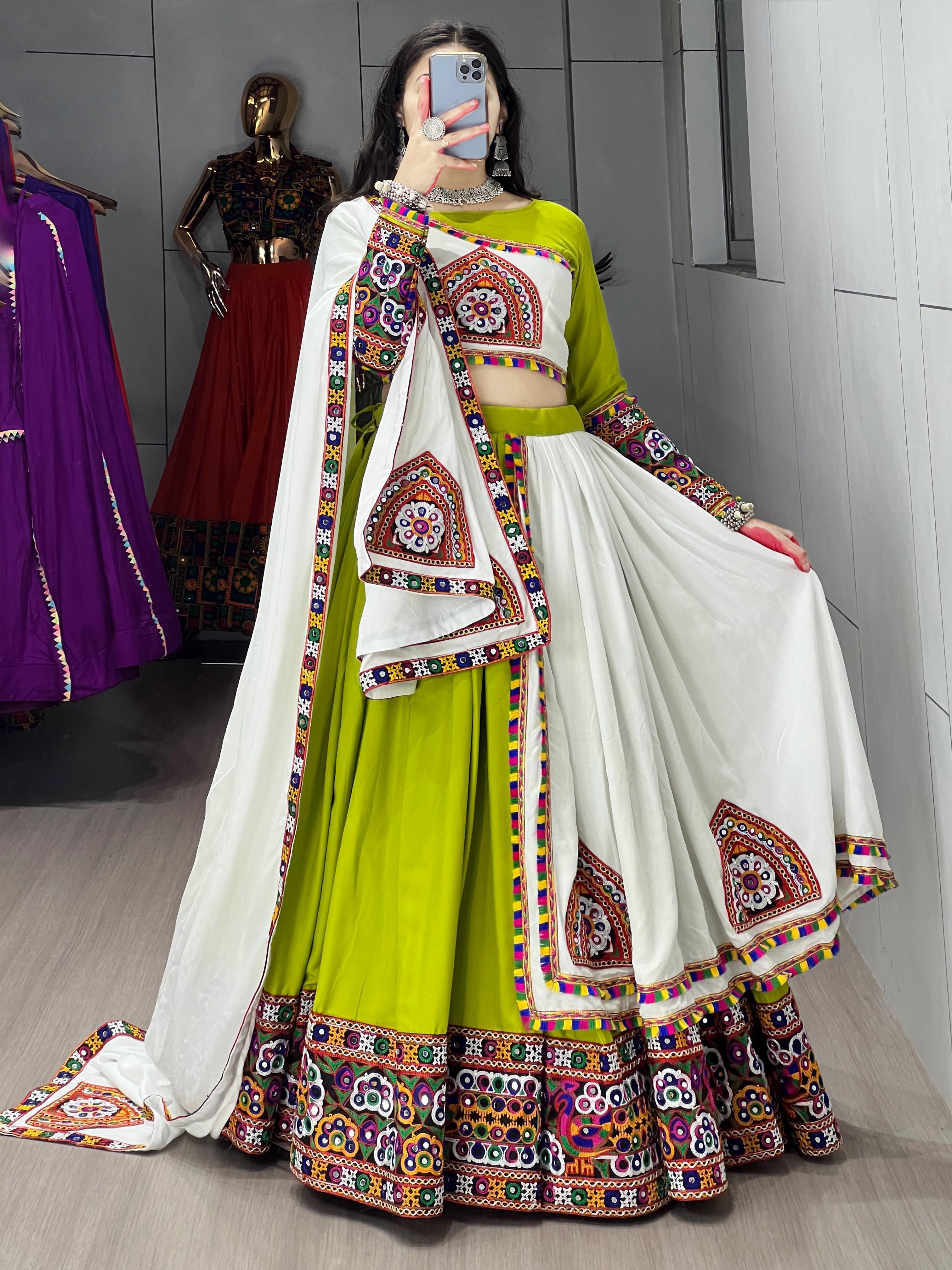 Parrot White Traditional Gamthi Work Navratri Lehenga with Real Mirror Work and Layer Patta Border by The Beauty Queen Surat