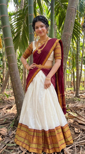 Off-White and Deep Maroon Mul Cotton Zari Weaving Work South Indian Half Saree Langa Voni Set flat lay view by The Beauty Queen