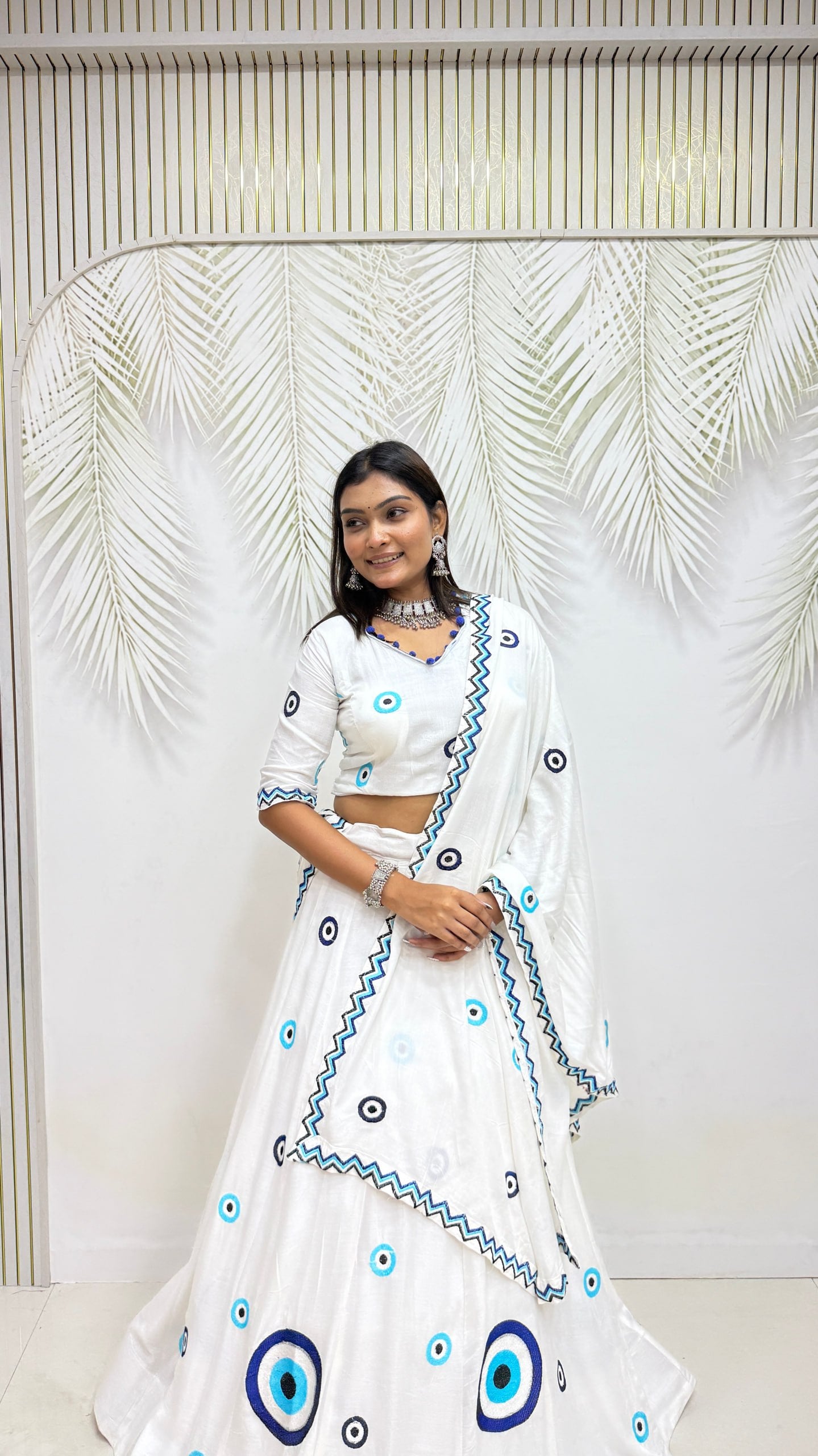 Model Wearing Off White Pure Cotton Evil Eye Heavy Thread Work Lehenga Choli Set By The Beauty Queen