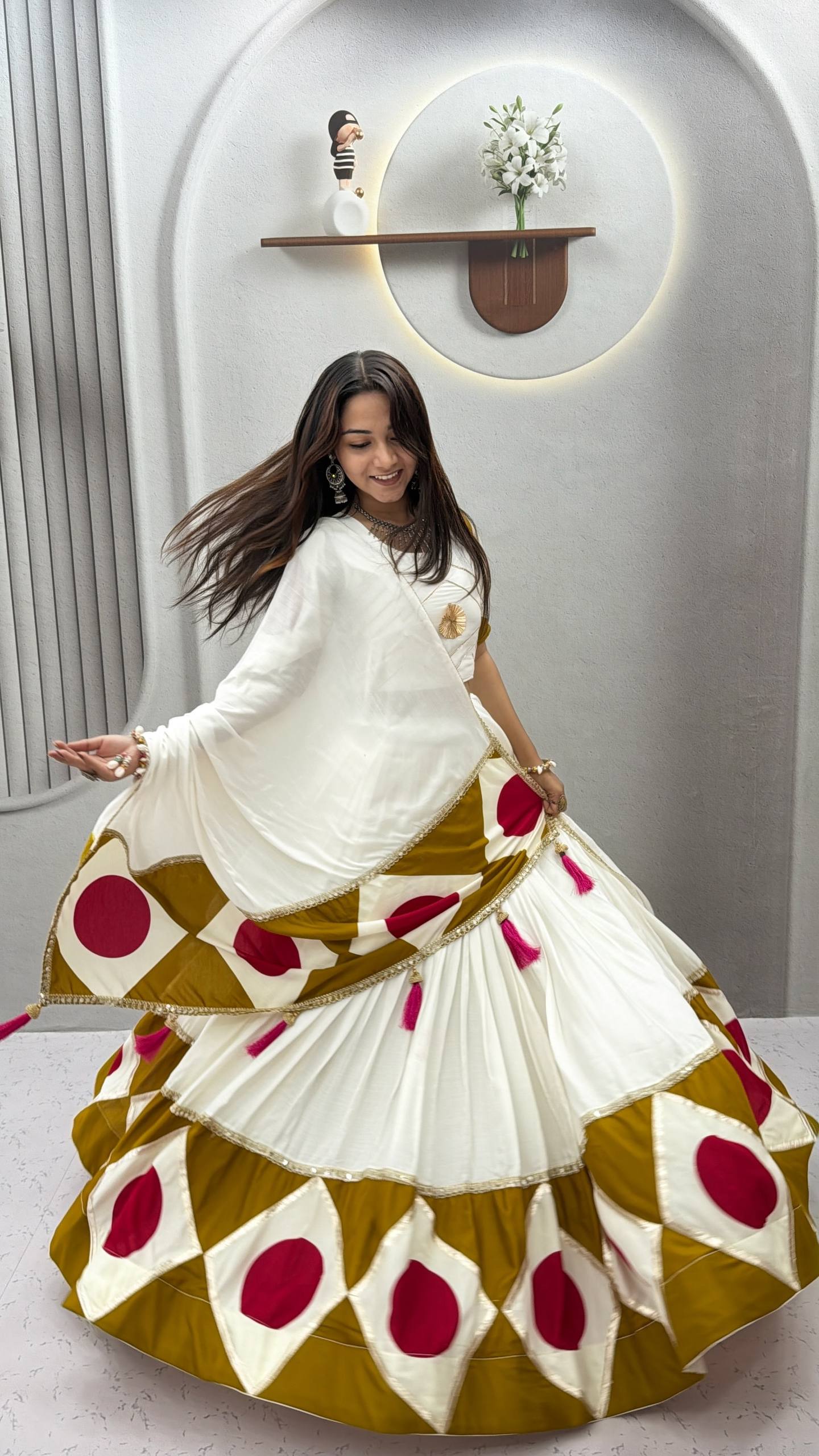 Model Posing In Off-White Pure Cotton Geometric Print And Gota Patti Work Navratri Lehenga Choli Set By The Beauty Queen