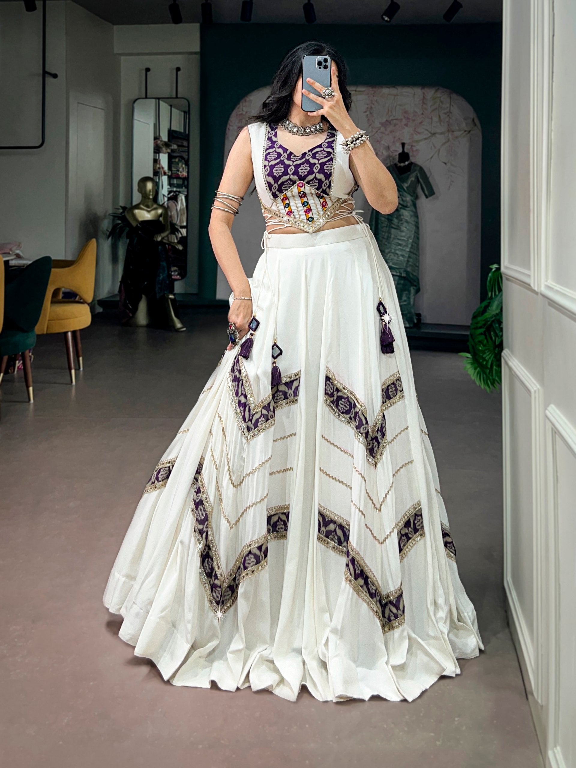 Model wearing Off-White & Purple Pure Rayon Elegance Enhanced With Heritage Prints And A Beautifully Crafted Gamthi Mirror Lace Blouse Navratri Lehenga Choli Set by The Beauty Queen