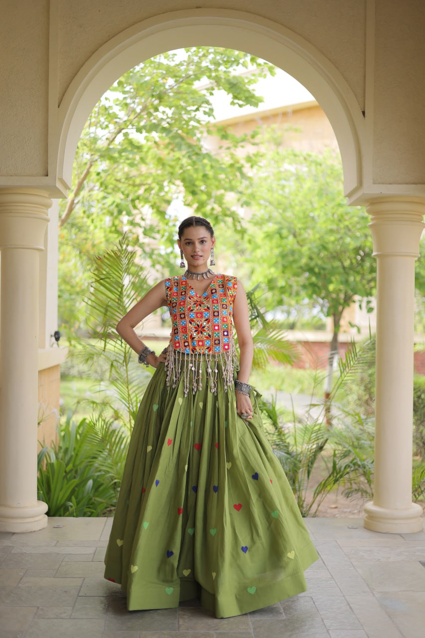 Model Posing In Olive Green Cora Cotton Heart Thread Embroidery Navratri Lehenga Choli Set By The Beauty Queen