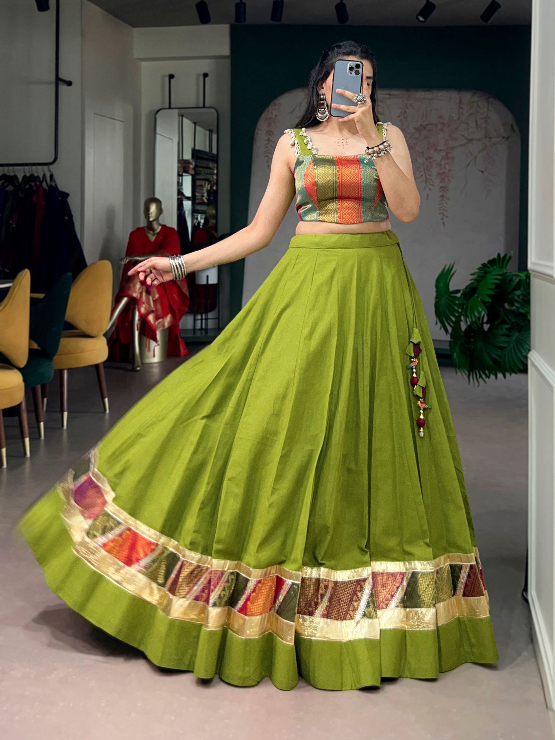 Model wearing Olive Green Cotton Lehenga Enhanced with Zari Weaving Embossed Design Work and Delicate Lace Touch-Up Navratri Chaniya Choli Set by The Beauty Queen