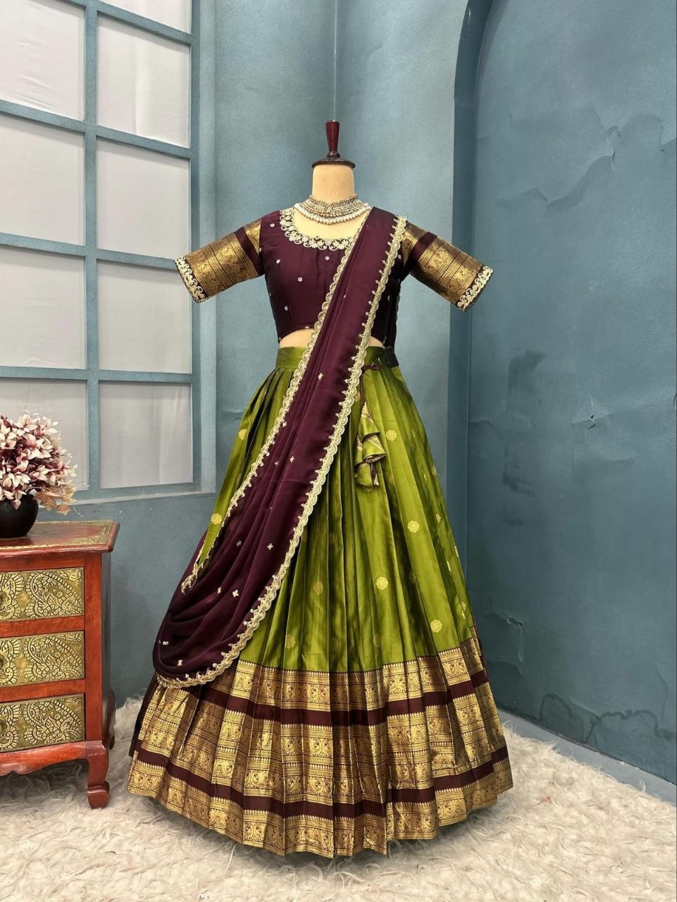Olive Green and Maroon Kanjiveram Silk Fully Stitched Half Saree Lehenga Choli Set flat lay view by The Beauty Queen