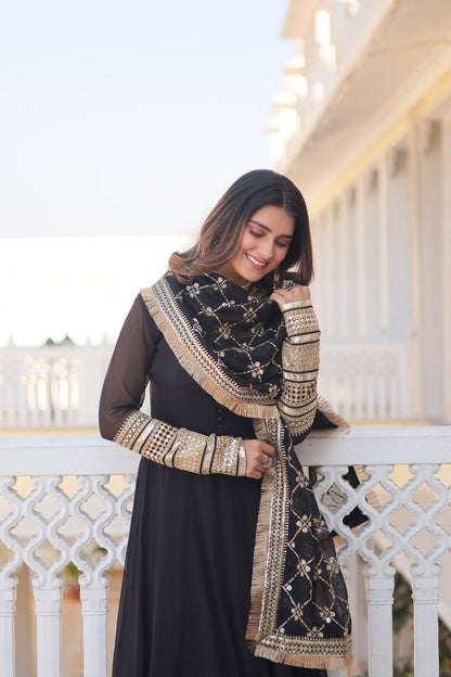 Black Faux Blooming Gown With Dupatta With Attractive Embroidered Sequins Work With Lace Border