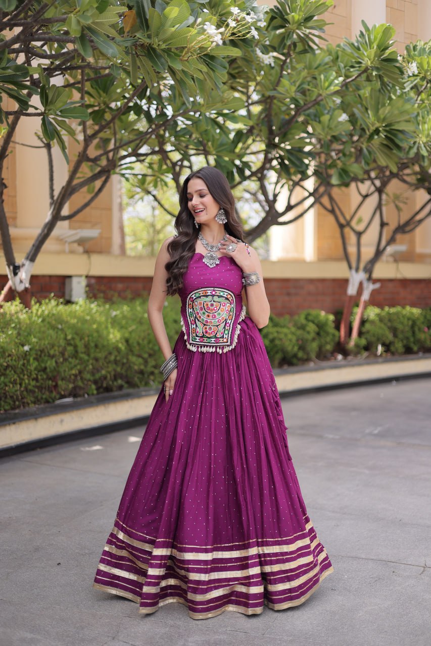 Magenta Purple 14kg Rayon Navratri Special Flared Lehenga Choli Set with Sparkling Mukaish (Badla) Work, Multi-Line Gota Patti Borders & Kutchi Embroidered Cowrie Shell Sleeveless Blouse