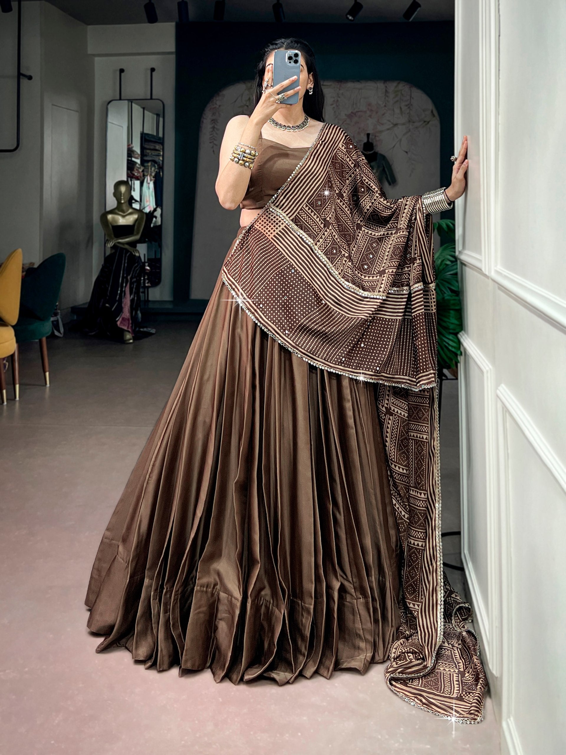 Coffee Brown Moonga Silk Navratri Special Flared Plain Lehenga Choli Set with Sleeveless Strappy Blouse & Geometric Bandhej Printed Satin Dupatta with Zari Lace Border