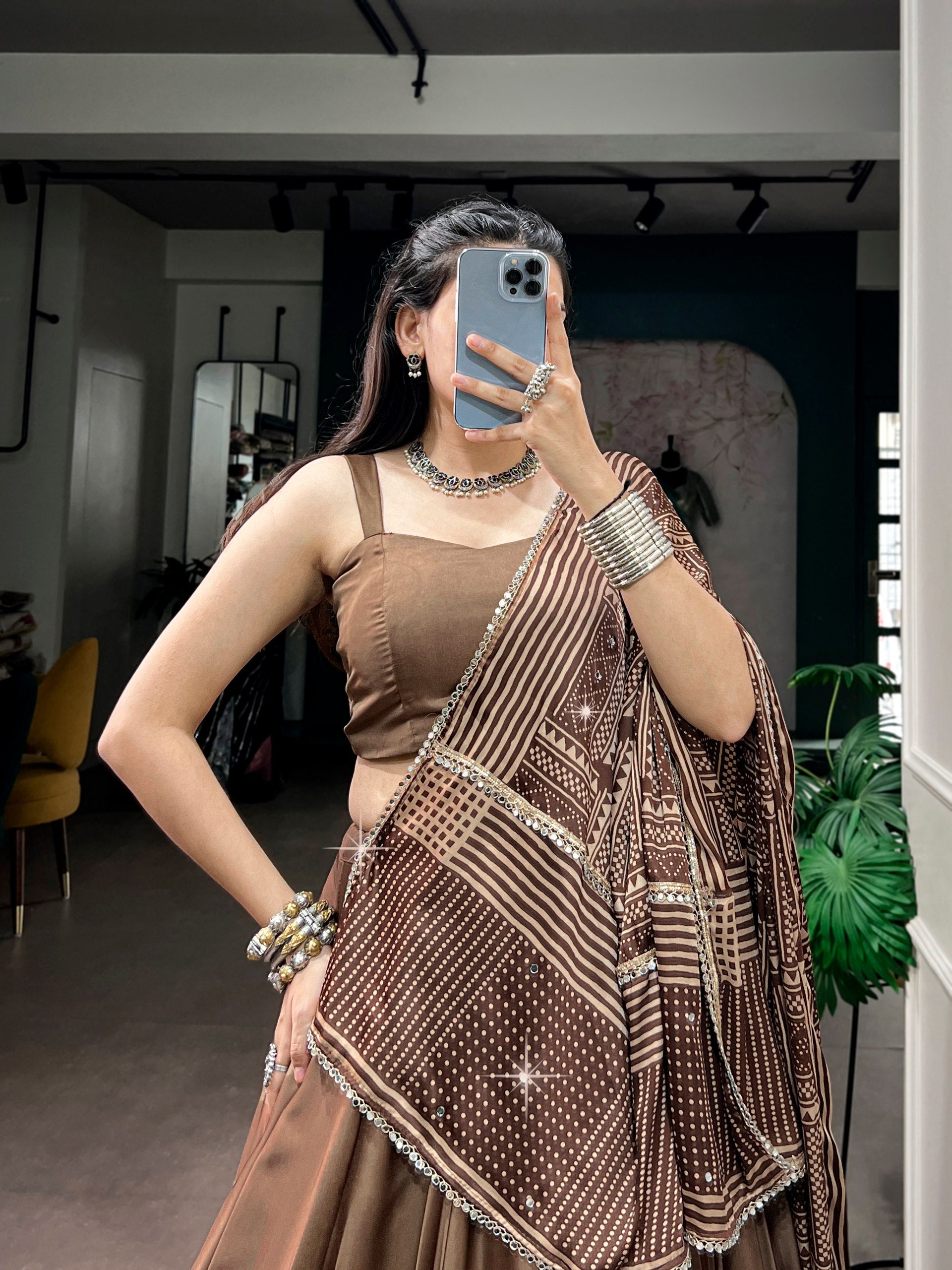 Coffee Brown Moonga Silk Navratri Special Flared Plain Lehenga Choli Set with Sleeveless Strappy Blouse & Geometric Bandhej Printed Satin Dupatta with Zari Lace Border