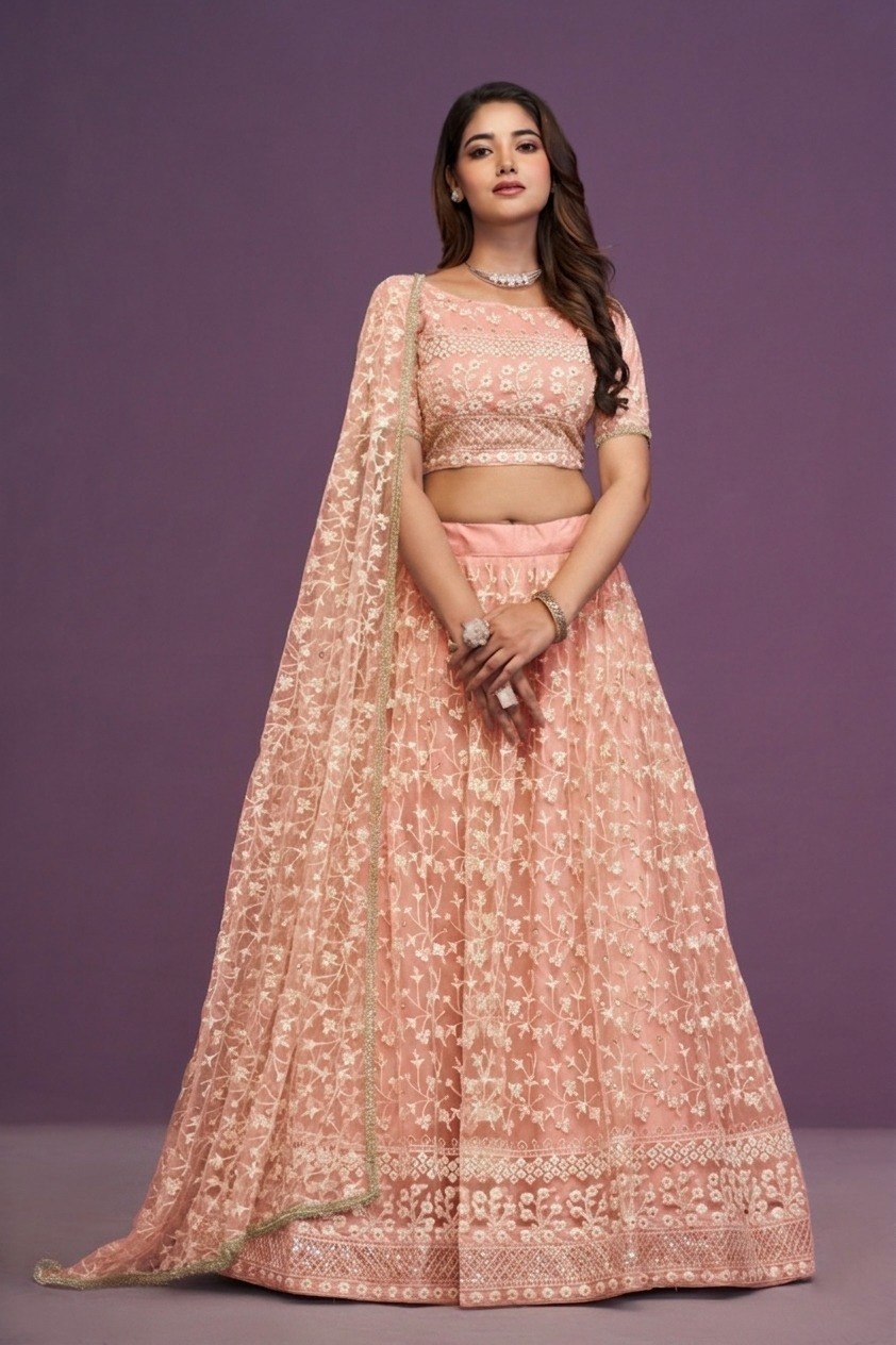 Blush Peach Soft Net Flared Semi-Stitched Lehenga Choli Set with Delicate Floral Threadwork, Shimmering Sequins, Boat Neck Choli & Matching Embroidered Dupatta with Cancan & Canvas