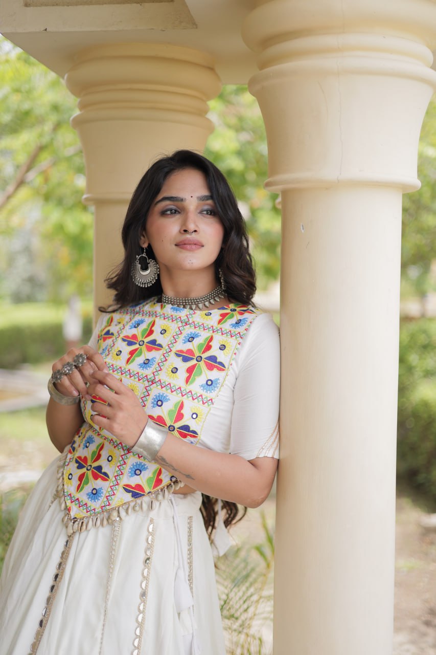 Off-White Rayon Navratri Lehenga Choli With Multi Mirror Lace Work, Attached Chain Detail & Tassels