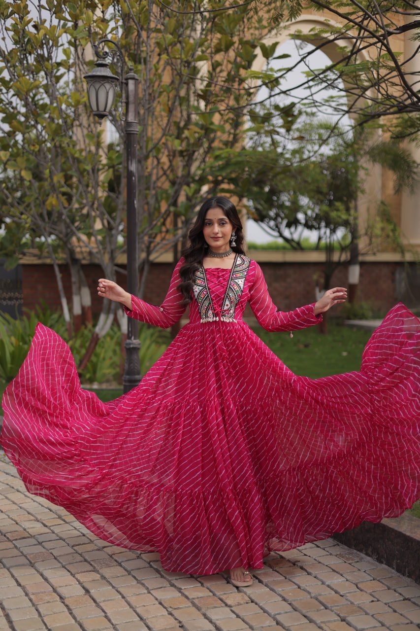 Rani Pink Laheriya Print Faux Georgette Navratri Gown With Kutchi Patchwork Yoke & Shell Tassels