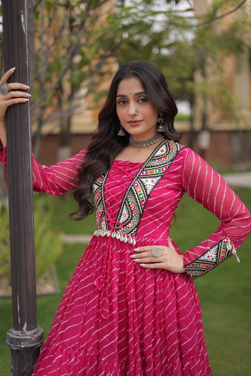 Rani Pink Laheriya Print Faux Georgette Navratri Gown With Kutchi Patchwork Yoke & Shell Tassels