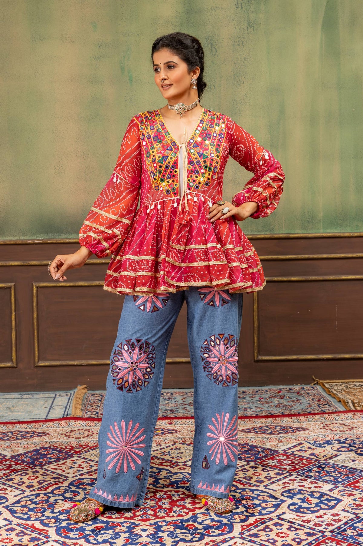 Red Faux Georgette Bandhani Print Ruffle Peplum Jacket With Real Mirror Work Embroidery & Embroidered Denim Jeans Navratri Fusion Set