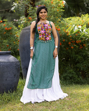 White pure rayon cotton plain frill pattern Navratri lehenga with micro cotton inner, Bottle Green Kutchi mirror embroidered strap top, cowrie shell accents, and leheriya print front overlay