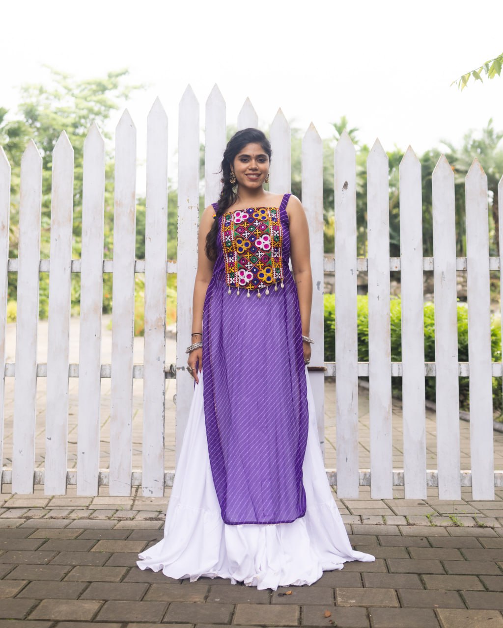 White pure rayon cotton plain frill pattern Navratri lehenga with micro cotton inner, Purple Kutchi mirror embroidered strap top, cowrie shell accents, and leheriya print front overlay