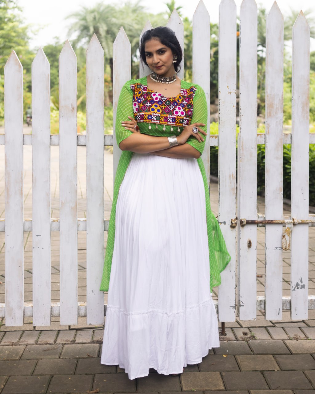 White pure rayon cotton plain frill pattern Navratri lehenga with micro cotton inner, parrot green Kutchi mirror embroidered blouse with cowrie shells, and green leheriya long shrug