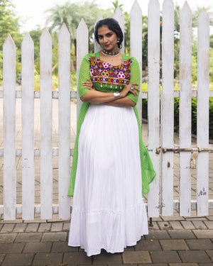 White pure rayon cotton plain frill pattern Navratri lehenga with micro cotton inner, parrot green Kutchi mirror embroidered blouse with cowrie shells, and green leheriya long shrug