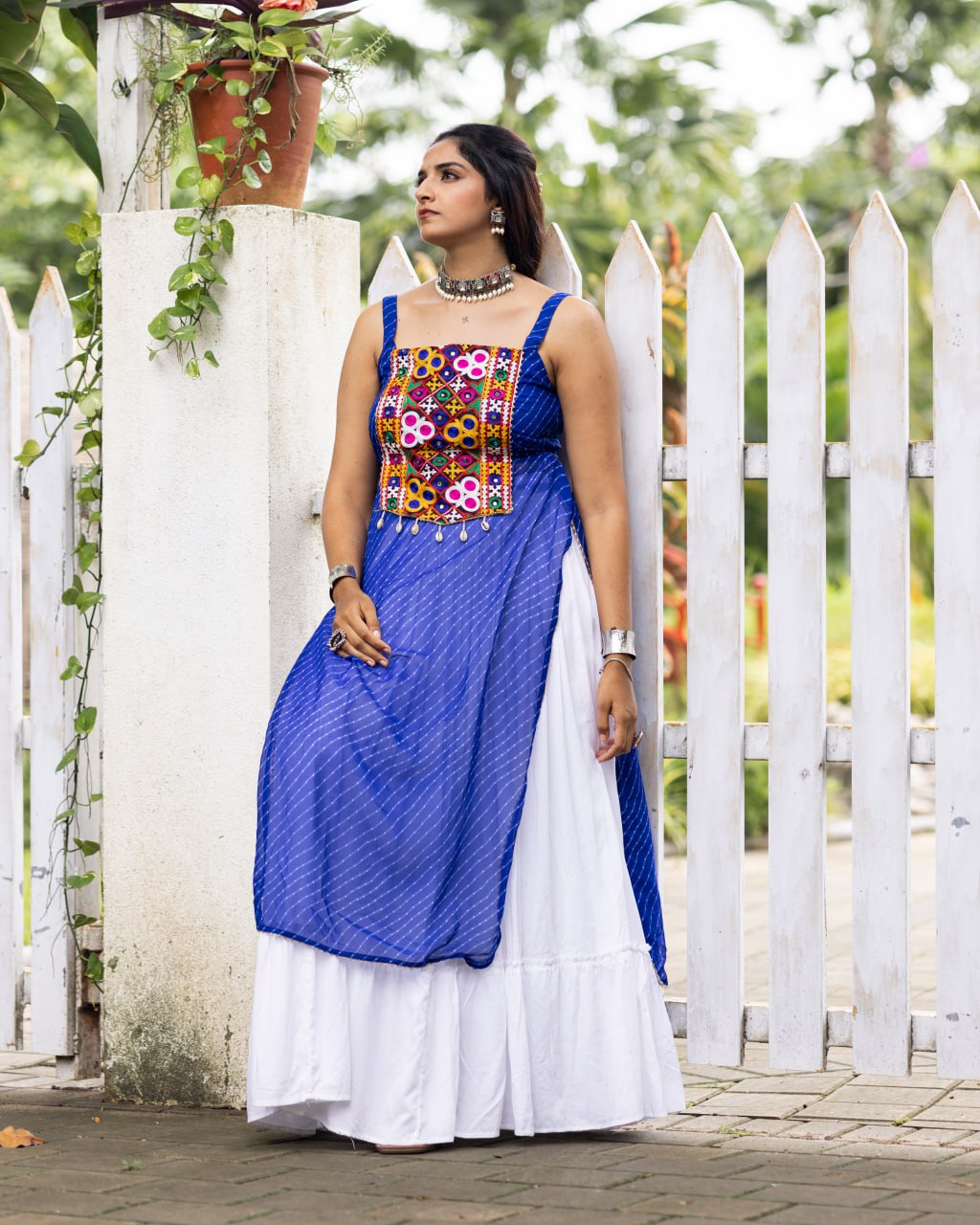 White pure rayon cotton plain frill pattern Navratri lehenga with micro cotton inner, Royal Blue Kutchi mirror embroidered strap top, cowrie shell accents, and leheriya print front overlay