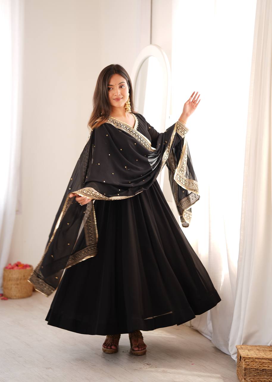 Jet Black Faux Georgette Anarkali Gown Suit Set with Golden Sequin Embroidery Border V-Neckline, Matching Pants & Heavily Embroidered Cutwork Lace Dupatta