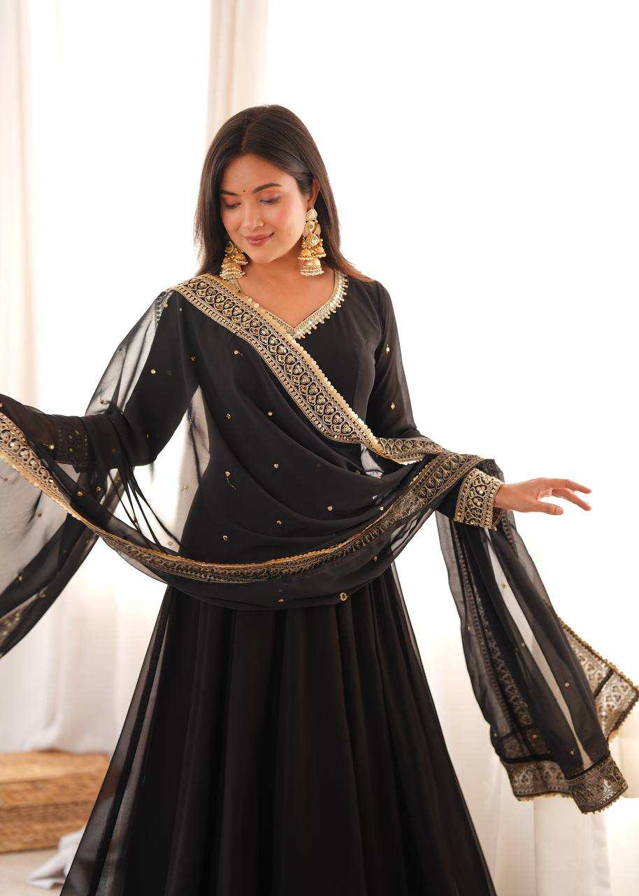 Jet Black Faux Georgette Anarkali Gown Suit Set with Golden Sequin Embroidery Border V-Neckline, Matching Pants & Heavily Embroidered Cutwork Lace Dupatta