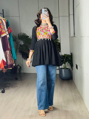 Black pure rayon cotton Gamthi Kutchi embroidered short peplum kurti with real mirror work and cowrie shell lace border