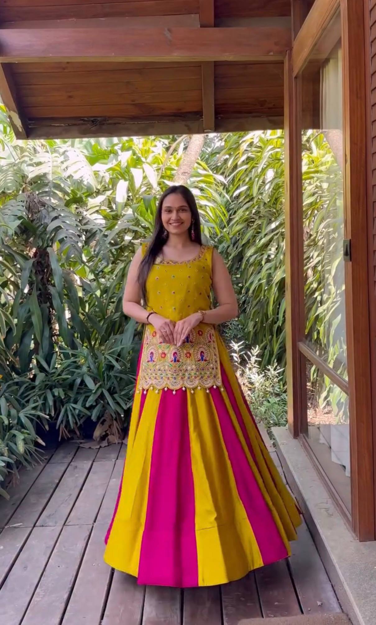 Yellow and Rani Pink Vichitra Silk Navratri Special Panelled Lehenga Choli Set with Heavy Embroidered Peplum Top by The Beauty Queen