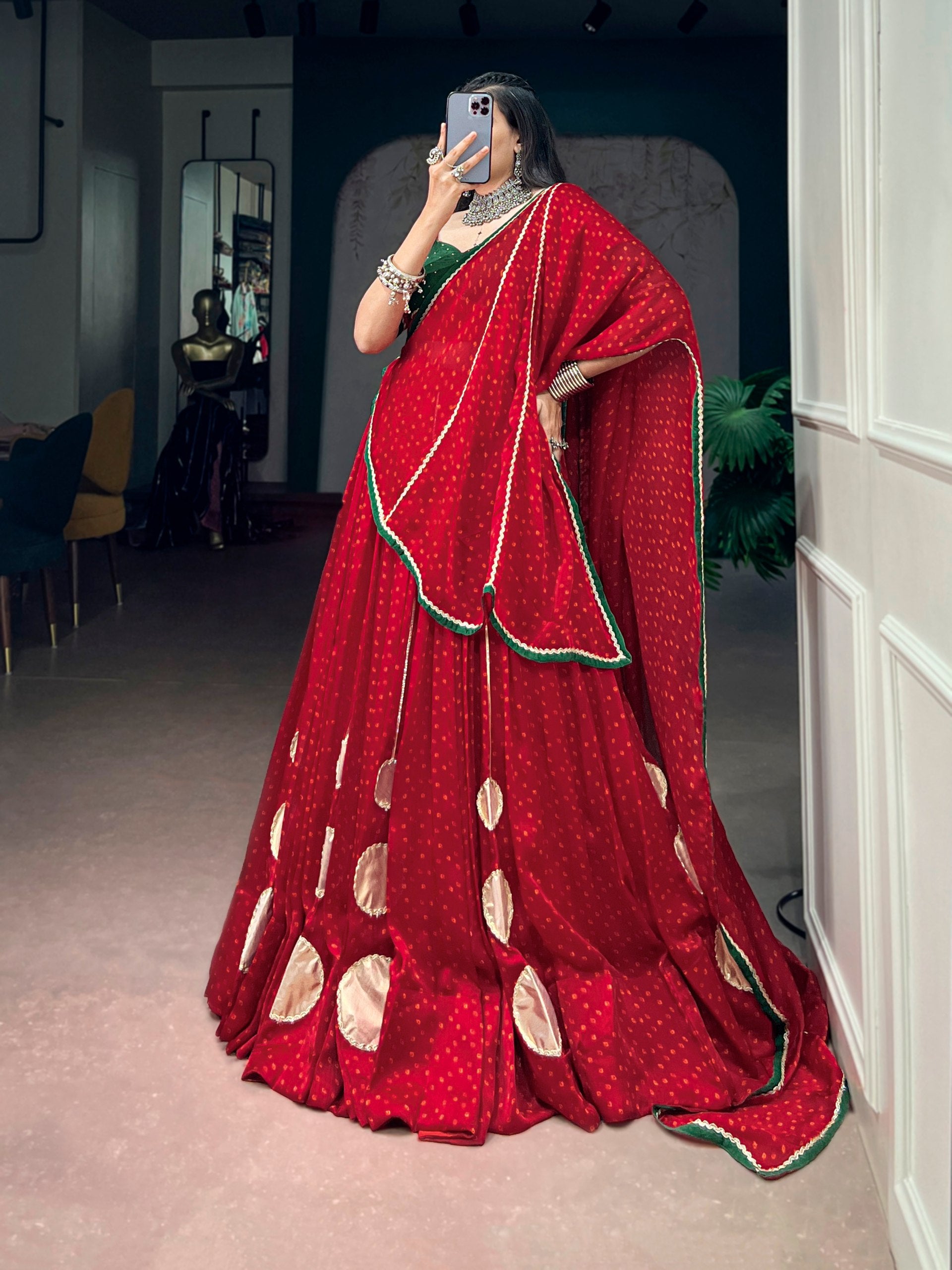 Navratri Crimson Red Satin Chiffon Flared Bandhej Lehenga Set with Metallic Gota Patchwork & Contrast Emerald Green Dola Silk Hotfix Blouse