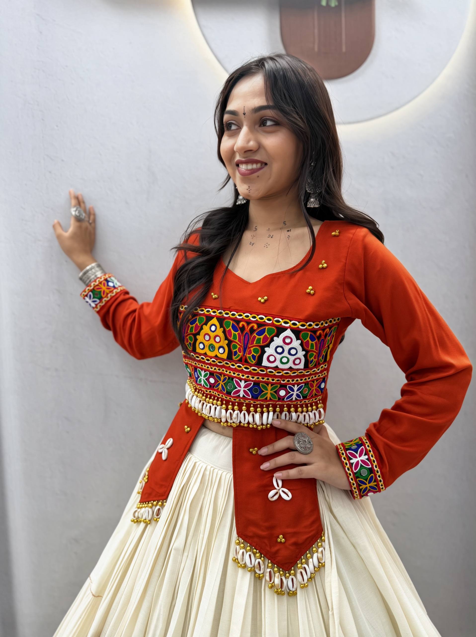 Navratri Off-White Multi-Tiered Flared Lehenga with Rust Red Kediya Jacket Blouse, Real Kodi & Kutchi Gamthi Hand Work