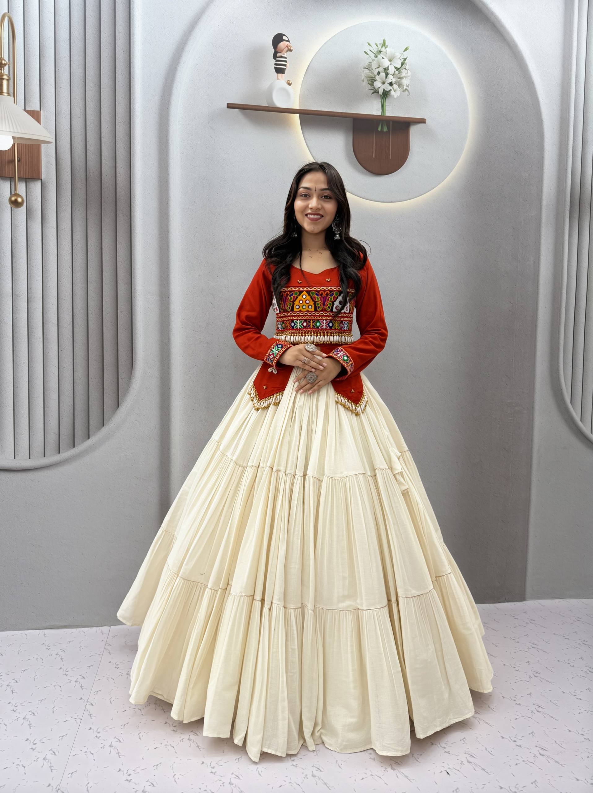 Navratri Off-White Multi-Tiered Flared Lehenga with Rust Red Kediya Jacket Blouse, Real Kodi & Kutchi Gamthi Hand Work