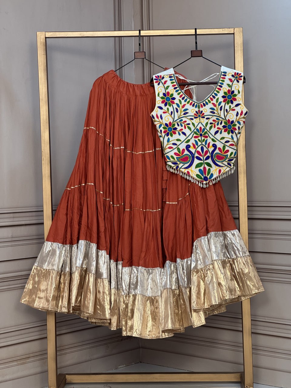 Navratri Rust Orange Rayon Tiered Flared Lehenga Choli Set with 2 Ton Lampi Lace & Embroidered Blouse