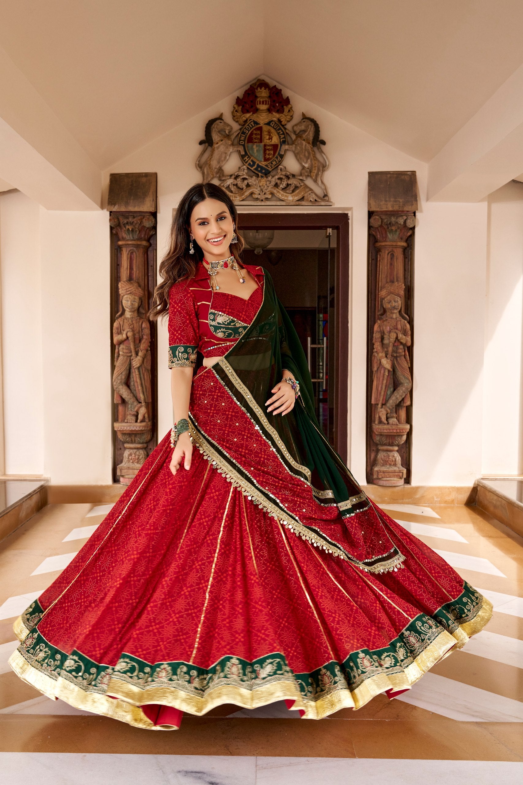 Navratri Maroon Red Georgette Bandhej Foil Print Flared Lehenga Choli with Embossed Emerald Green Border & Gota Patti Lace Work