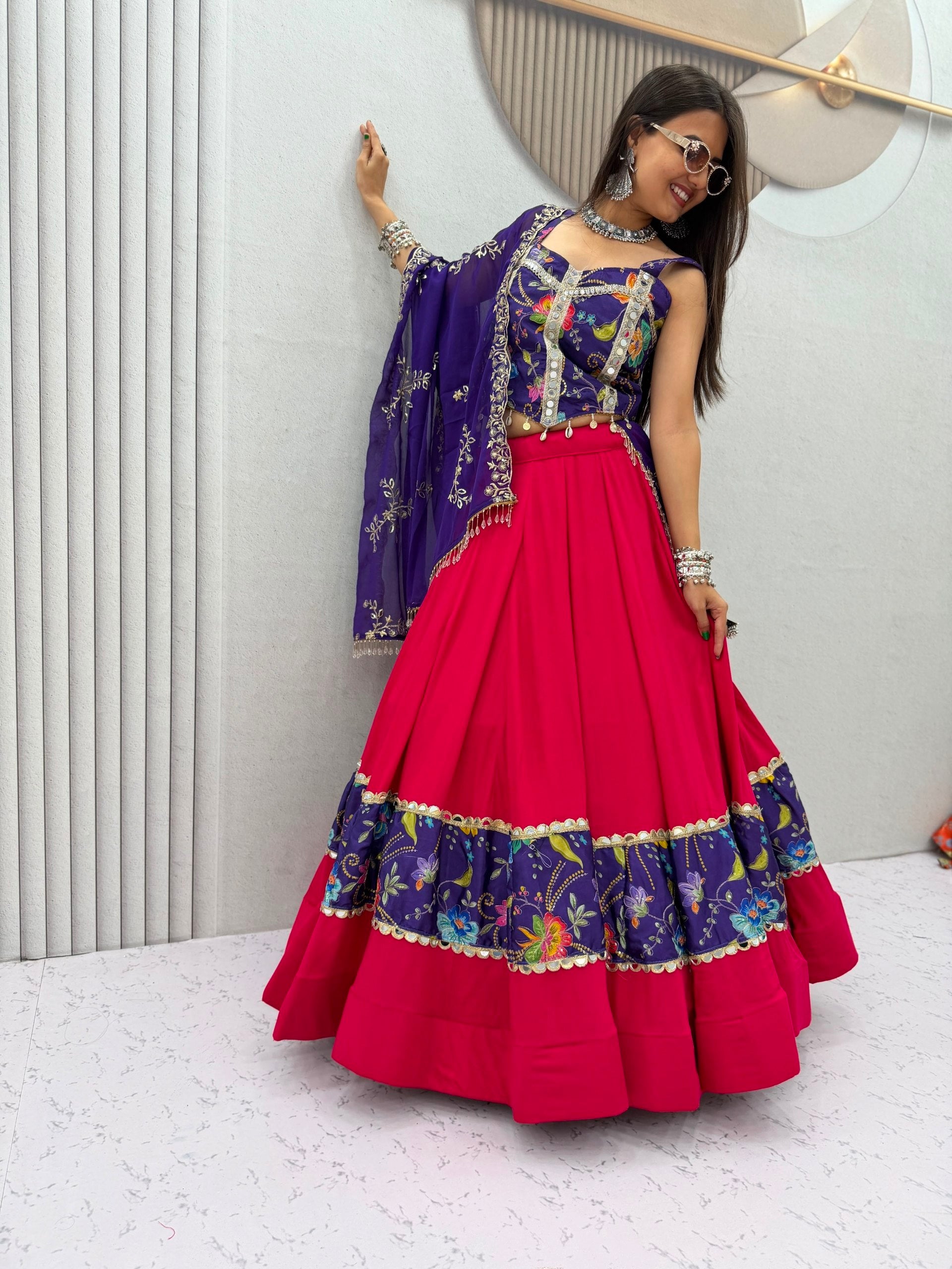 Model Posing Indoors Wearing Pink & Purple Pure Cotton Real Mirror Work Position Print Navratri Lehenga Choli Set By The Beauty Queen