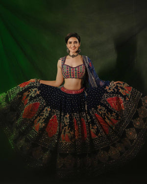 Model twirling in Royal Navy Blue Heavy Muslin Cotton Beautiful Digital Print & Real Mirror Work Navratri Lehenga Choli Set by The Beauty Queen