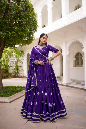 Model wearing Royal Purple Pure Chanderi Bandhej Print With Silver Lace Touch-Up Navratri Lehenga Choli Set by The Beauty Queen