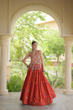 Model Posing In Rust Orange Cora Cotton Heart Thread Embroidery Navratri Lehenga Choli Set By The Beauty Queen