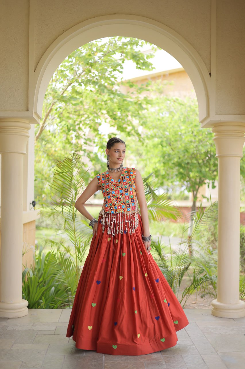 Model Posing In Rust Orange Cora Cotton Heart Thread Embroidery Navratri Lehenga Choli Set By The Beauty Queen