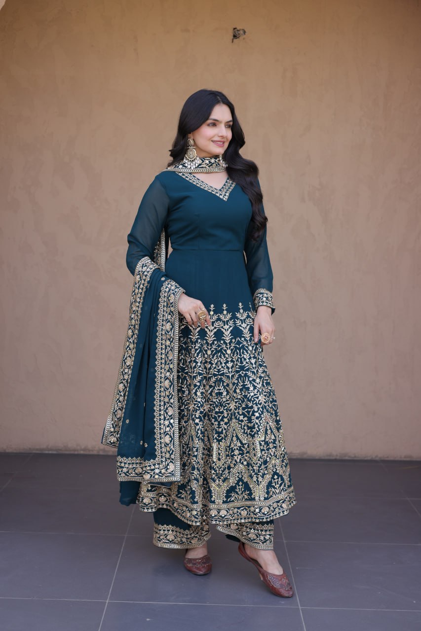 Model Wearing Teal Blue Faux Blooming Georgette Embroidered Multi-Sequins Work Full Sleeves Gown Set By The Beauty Queen