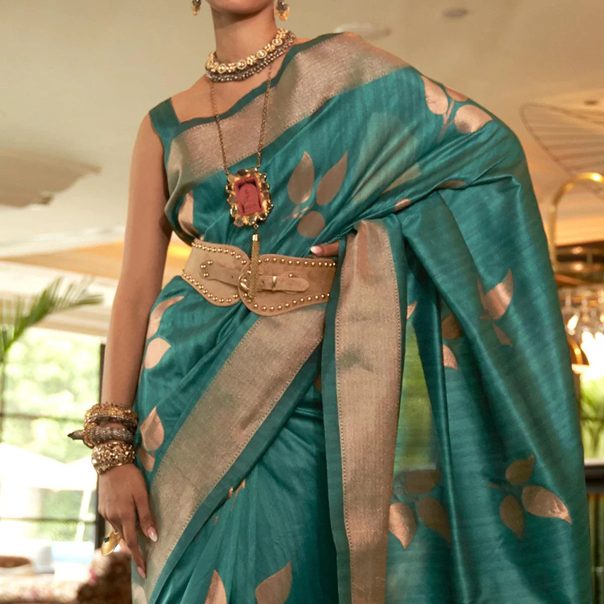 Turquoise Woven Art Silk Saree With Tassels