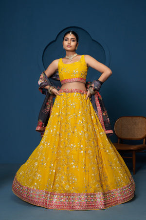 Model Wearing Bright Yellow Georgette Semi Cotton Zari And Sequence Embroidery Lehenga Set With Floral Dupatta By The Beauty Queen